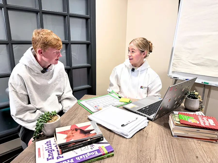 An Educamus Tuition tutor talking through a past paper question with a student
